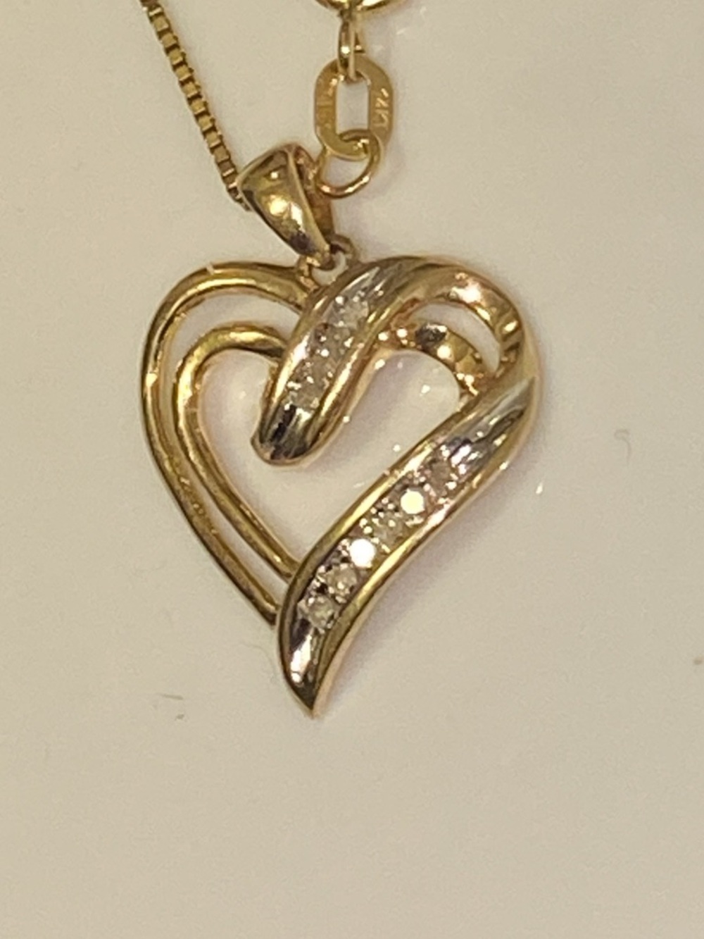 10K Solid Yellow Gold Diamond Ribbon Heart Pendant with Diamond Accents.